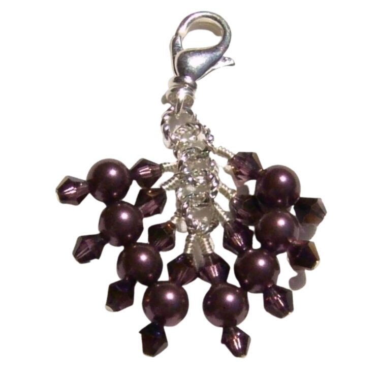 This beautiful beaded purse and handbag charm features burgundy crystal based pearls and stunning claret wine aurora borealis finish bicone crystals. There are eight dangles, each of which is sterling silver wire wrapped. Silver swivel lobster claw clasp makes it easy to attach this to your favorite handbag or sweater if using as a zipper pull, or to a sterling silver necklace chain for a gorgeous sparkling pendant. Length of purse charm is 2 inches including lobster claw clasp. One of a kind. Perfect gift idea for her.